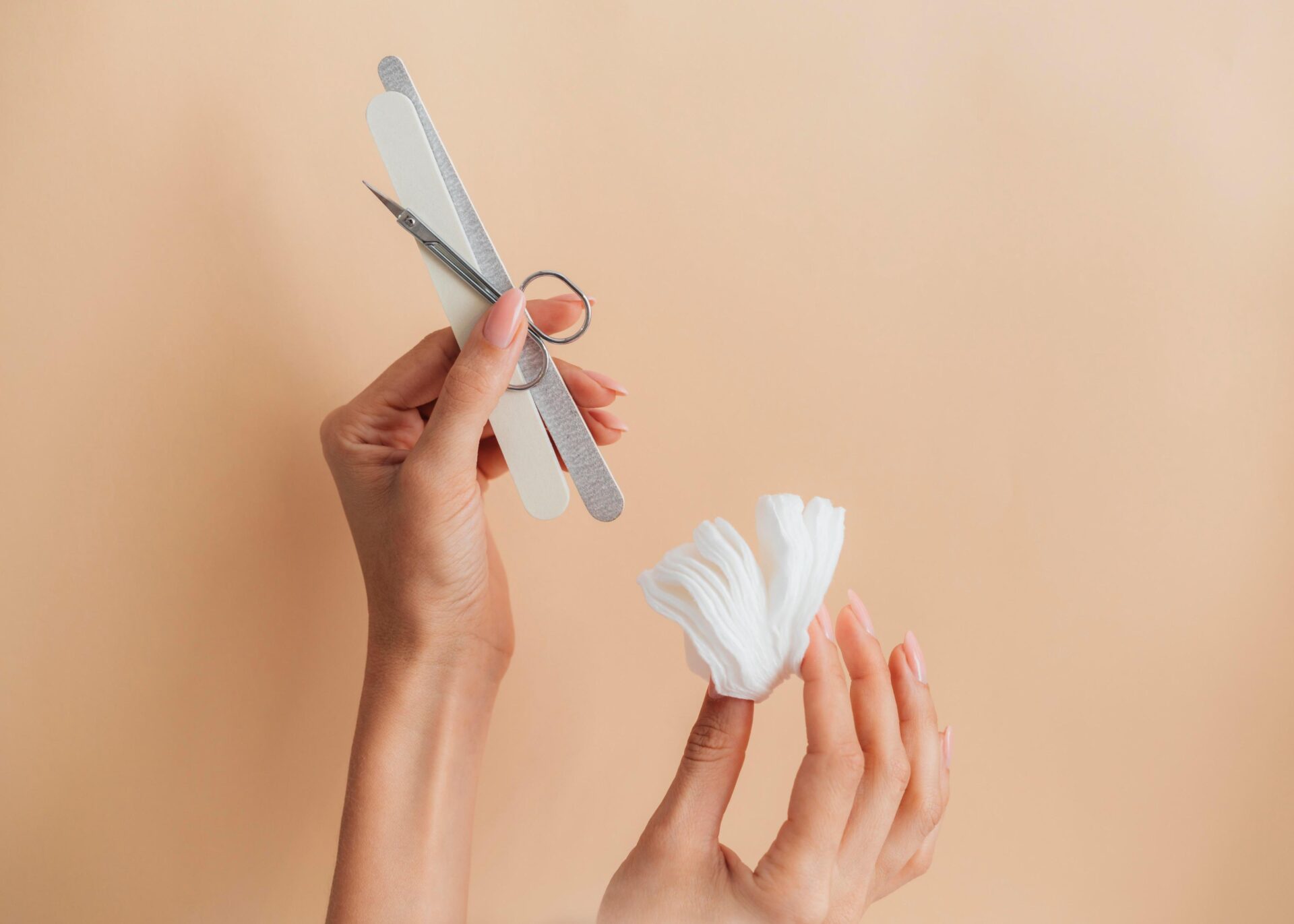 Nail accessories and cleaning tools laid out, showing essential items for how to clean nail clippers.