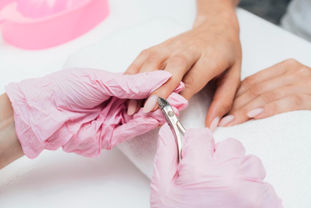 cutting and trimming cuticles by a professional