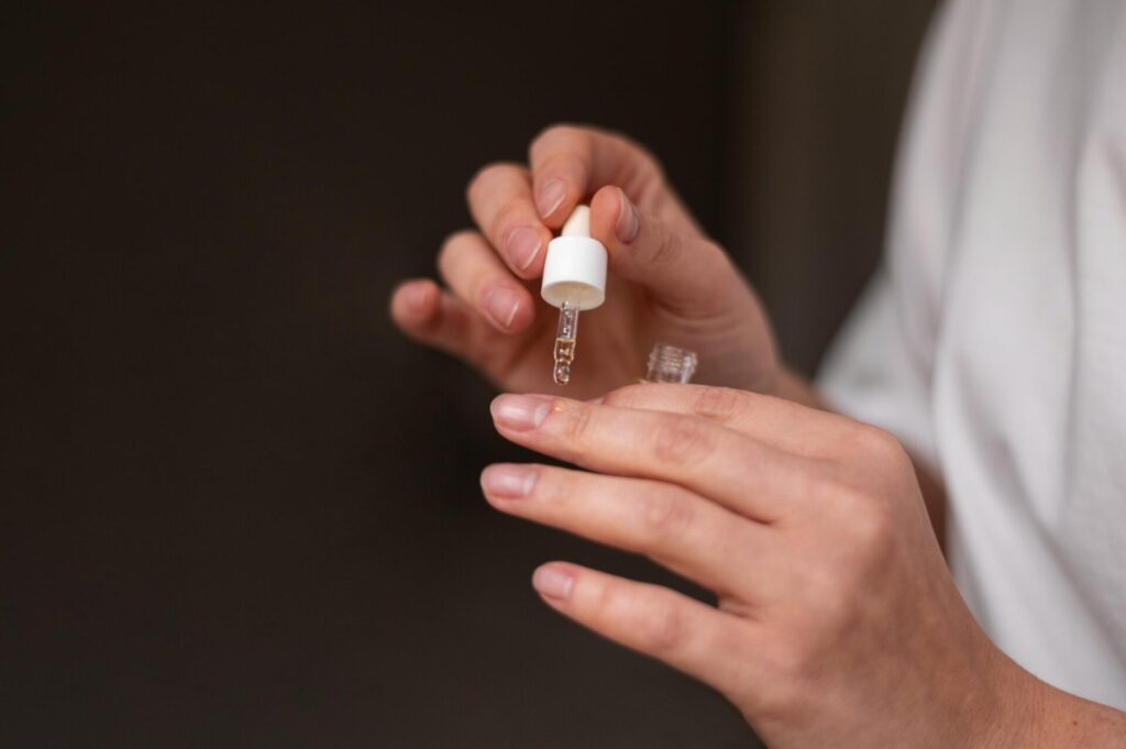 applying jojoba oil on cuticles