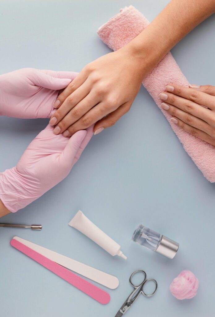 a professional is helping a client treating nails