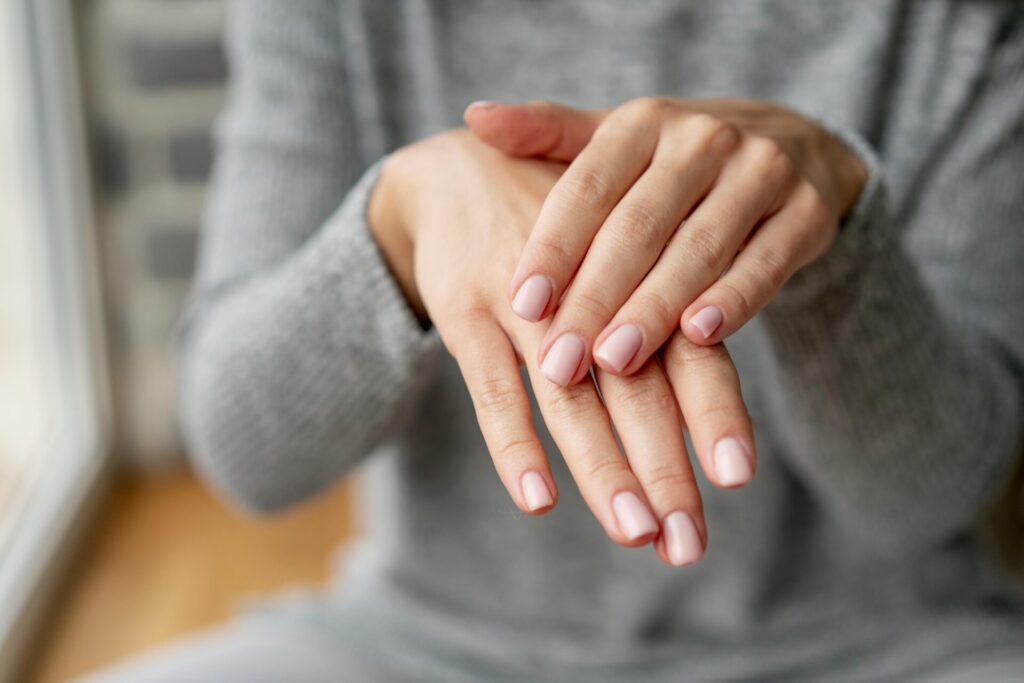 Elegant nails with a classic French manicure and a glossy finish.