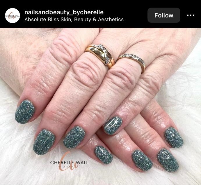 glittery gel polish in a deep greenish hue