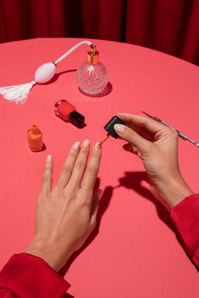 a women doing her nails with a gel polish